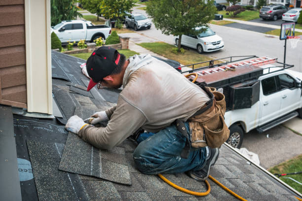 Professional Roofing technician working in Brockton, MA